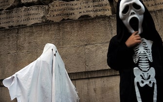 Children dressed as ghosts  attend a Halloween party in the Sofia on October 31, 2010 . AFP PHOTO / NIKOLAY DOYCHINOV (Photo credit should read NIKOLAY DOYCHINOV/AFP via Getty Images)
