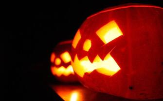 LONDON - OCTOBER 31:  A child enjoys traditional candle-lit Halloween pumpkins on October 31, 2007 in London.  (Photo by Peter Macdiarmid/Getty Images)