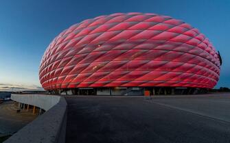 1278768857 MUNICH, GERMANY - OCTOBER 04: A general view of the Allianz Arena at twilight during the Bundesliga match between FC Bayern Muenchen and Hertha BSC at Allianz Arena on October 04, 2020 in Munich, Germany. (Photo by Boris Streubel/Getty Images)