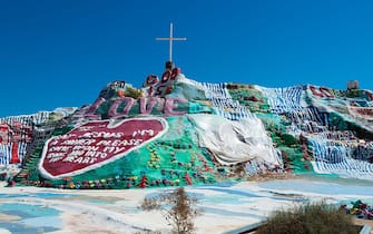 [UNVERIFIED CONTENT] Salvation Mountain is an art installation covering a hill in the Colorado Desert, north of Calipatria near Slab City, and several miles from the Salton Sea. It encompasses numerous murals and areas painted with Christian sayings and Bible verses.