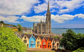 Cobh is on the south coast of County Cork, Ireland. It was the final port of call for the RMS Titanic. On a high point in the town stands St Colman's Cathedral, over a row of houses, the so-called â  Deck of Cardsâ  ,  each one differs in colour from its neighbouring building.
