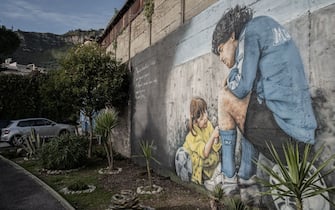NAPLES, ITALY - JUNUARY 8 - A mural depicting Argentine footballer Diego Armano Maradona outside the former Centro Sportivo Paradiso in Naples' Soccavo, January 4, 2021. Argentinean footballer Diego Armando Maradona was an important figure for the Neapolitan people. (Photo by Manuel Dorati/NurPhoto via Getty Images)