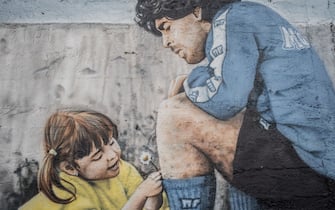 NAPLES, ITALY - JUNUARY 8 - A mural depicting Argentine footballer Diego Armano Maradona outside the former Centro Sportivo Paradiso in Naples' Soccavo, January 4, 2021. Argentinean footballer Diego Armando Maradona was an important figure for the Neapolitan people. (Photo by Manuel Dorati/NurPhoto via Getty Images)