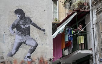 NAPLES, ITALY - JUNE 24: A mural by Argentine artist Santiago Spiga alias "Spiga" depicts Argentine former football player Diego Armando Maradona to celebrate the 30th anniversary of his famous "hand of God", in Naples, Italy on June 24, 2016. (Photo by Alessio Paduano/Anadolu Agency/Getty Images)