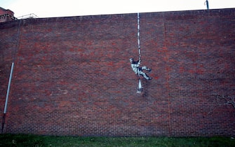 An artwork which has appeared on the wall of the former prison in Reading, Berkshire. Picture date: Monday March 1, 2121. PA Photo. Although its has not been officially claimed as the work of Banksy, the picture bares a resemblance to the artists other works. Photo credit should read: Steve Parsons/PA Wire (Photo by Steve Parsons/PA Images via Getty Images)