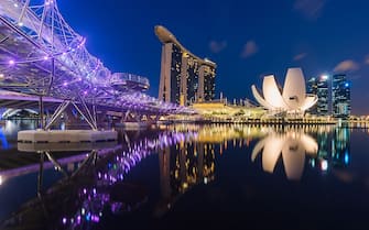 [UNVERIFIED CONTENT] morning twilight blue hour of marina bay landmark with beautiful reflection in the Singapore River, Singapore
