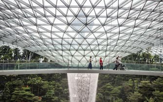 A 40 metres high largest indoor waterfall in the world, Rain Vortex sits in the lush greenery of the Forest Valley inside the Jewel Changi Airport on December 05, 2019 in Singapore.
 (Photo by WF Sihardian/NurPhoto via Getty Images)