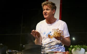 epa03715094 Scottish born celebrity chef Gordon Ramsay cooks with a lobster during a presentation at the Good Food and Wine show in Cape Town, South Africa, 24 May 2013. Some of the world's top chefs attend the Good Food and Wine Fair cooking at the Chefs in Action Theater for capacity audiences.  The show also provides a meeting place for buyers, distributors, retailers and bar and restaurant owners as well as food lovers of all ages.  EPA/NIC BOTHMA
