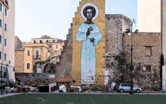 PALERMO, ITALY - NOVEMBER 21: A giant mural depicting Benedict the Moor, one of Palermo's patron, is pictured in the area of Ballaro market on November 21, 2019 in Palermo, Italy. (Photo by Emanuele Cremaschi/Getty Images)