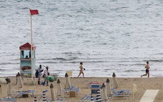 525398324 Sandstorm in Miramare, the seaside resort of Rimini and Riccione, forcing people to go away from the beach, on August 16, 2014. (Photo by Elena Aquila/NurPhoto) (Photo by NurPhoto/Corbis via Getty Images)