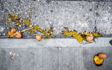 Broken eggs on the sidewalk in New York on Monday, April 6, 2020. Wholesale egg prices have shot up, tripling, due to consumerâ€™s demand for the product while remaining home during the COVID-19 pandemic. (ÂPhoto by Richard B. Levine)