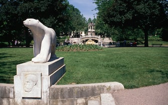 Jardin Darcy, statue of a bear in the foreground, Dijon, Burgundy, France.