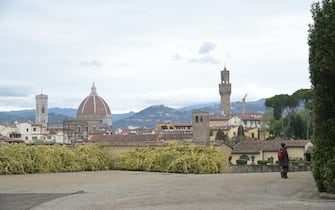 FLORENCE, ITALY - APRIL 27: A couple of tourists are seen in the park of the Boboli gardens from the viewpoint of the cathedral and the arnolfo tower on the day of the reopening, on April 27, 2021 in Florence, Italy. Cafes, bars, restaurants, cinemas and concert halls will partially reopen across Italy in a boost for coronavirus-hit businesses, as parliament debates the government's 220-billion-euro ($266-billion) EU-funded recovery plan, the biggest in Europe so far. (Photo by Paolo Lo Debole/Getty Images)