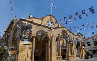 NICOSIA, CYPRUS - JULY 15: Panayia Phaneromenis Church and greek flags on July 15, 2021 in Nicosia, Cyprus.  (Photo by Athanasios Gioumpasis/Getty Images)