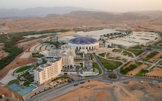 An aerial view shows Convention & Exhibition Centre in the Omani capital Muscat's Bawshar area on April 9, 2021. (Photo by Haitham AL-SHUKAIRI / AFP) (Photo by HAITHAM AL-SHUKAIRI/AFP via Getty Images)