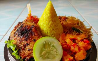 Tumpeng was Indonesian Local Food that fill with yellow rice (cone shaped) and any kind of condiment like fried/grilled chicken, spicy saute potato, saute glass noodle, saute tempe and vegetables.