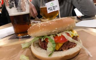 Beyond Meat hamburger is seen in a pub in Milan, Italy, on January 04 2020. Beyond Meat is a Los Angeles-based producer of plant-based meat substitutes founded in 2009 by Ethan Brown. The company's initial products became available across the United States in 2012.The company has products designed to simulate chicken, beef, and pork sausage.According to a life cycle assessment (LCA) of the Beyond Burger from the University of Michigan, the Beyond Burger generates 90% less greenhouse gas emissions, requires 46% less energy, has &gt;99% less impact on water scarcity and 93% less impact on land use than a Â¼ pound of U.S. beef. (Photo by Mairo Cinquetti/NurPhoto via Getty Images)