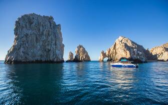 CABO SAN LUCAS, MEXICO - JANUARY 10: Sunrider boat navigate infront the rock arch of cabo San Lucas during a whale watching tour on January 10, 2021 in Cabo San Lucas, Mexico. Every winter the humpback whale arrives to the Mexican Pacific coast where groups of tourist gather with local guides to practice the whale watching. (Photo by Alfredo Martinez/Getty Images)