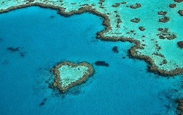 UNDATED - QUEENSLAND, AUSTRALIA: (FRANCE OUT) Aerial view of the aptly named Heart Reef, a heart-shaped coral reef in the Coral Sea, in the Great Barrier Reef, Whitsunday Islands off the coast of Queensland, Australia. (Photo by Emmanuel VALENTIN/Gamma-Rapho via Getty Images)