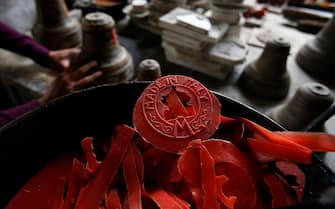 A 'Made in Italy' wax residuals sits ahead of use at Fonderia Pontificia Marinelli bell foundry in Agnone, Italy, on Monday, Nov. 11, 2013. Italy's one-year borrowing costs fell to a record low at a sale of 6.5 billion euros ($8.7 billion) of bills, the first auction after the European Central Bank unexpectedly cut its benchmark interest rate. Photographer: Alessia Pierdomenico/Bloomberg via Getty Images