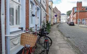 Historical city centre buildings with bicycles in the foreground are seen in Nyborg , Fyn (Funen), Denmark, on 2 August 2021  (Photo by Michal Fludra/NurPhoto via Getty Images)