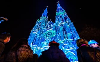The Catharina church in Eindhoven is lit in arty colours during the GLOW light-art festival in Eindhoven, the Netherlands,on November 8, 2014. AFP PHOTO / ANP / REMKO DE WAAL ***netherlands out***        (Photo credit should read REMKO DE WAAL/AFP via Getty Images)