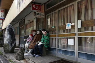 MIYOSHI, JAPAN - APRIL 22:  Hand-made dolls are seated outside a closed-down shop as others are placed around the village by local resident Tsukimi Ayano to replace the dwindling local population on April 22, 2016 in Nagoro village, in Miyoshi, Japan. Likely more dolls than the number of inhabitants are placed around the village called "Kakashi No Sato". According to Japan's Statistic Bureau, the percentage of people over 65 years old in Japan is 26.8% while that of the the world is 8.2%. The National Institute of Population and Social Security Research in Tokyo, Japan's population, now around 128 million, is expected to dip below 100 million in 2046.  (Photo by Carl Court/Getty Images)