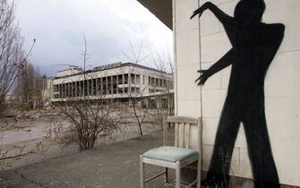 A mural is seen on a wall of the ghost city of Pripyat, near Chernobyl's nuclear power plant, 20 April 2006.  On April 26, Ukraine marks the 20th anniversary of an accident at the Chernobyl nuclear power plant, which affected millions of people, gobbled up astronomic amount of international funds and remains a grim symbol of hazzards of atomic energy.  AFP PHOTO/  Sergei SUPINSKY (Photo by Sergei SUPINSKY and - / AFP) (Photo by SERGEI SUPINSKY/AFP via Getty Images)