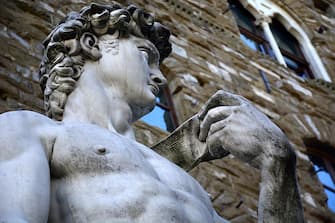 FLORENCE, ITALY - OCTOBER 30, 2015: A full-size copy of Michelangelo's marble statue of the Biblical hero David stands in the Piazza della Signoria beside the Palazzo Vecchio in Florence, Italy. The original statue of David, sculpted between 1501 and 1504, is on display at the Galleria dell'Accademia Museum, or Accademia Gallery, in Florence, Italy. (Photo by Robert Alexander/Getty Images)