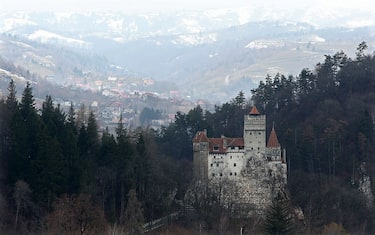 BRAN, ROMANIA - MARCH 10:  Bran Castle, famous as "Dracula's Castle," stands among Transylvanian mountains on March 10, 2013 in Bran, Romania. Bran Castle's reputation as the supposed home to Dracula corresponds little with Bram Stoker's novel, nor did Vlad Tepes, the sadistic 15th-century Wallachian prince, ever live there. Nevetheless the castle retains the myth and tourists flock there in large numbers. Bran Castle, along with the mountainous region of southern Transylvania, which is home to Saxon fortified towns and churches, are among the asssets the Romanian government hopes will bring increasing numbers of tourists to the country. Both Romania and Bulgaria have been members of the European Union since 2007 and restrictions on their citizens' right to work within the EU are scheduled to end by the end of this year. However Germany's interior minister announced recently that he would veto the two countries' entry into the Schengen Agreement, which would not affect labour rights but would prevent passport-free travel.  (Photo by Sean Gallup/Getty Images)