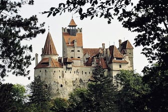BRASOV, ROMANIA - JUNE 23, 2005:  Bran Castle is being offered for sale to the Brasov County Council by the U.S.-based owner, Dominic von Habsburg who is a descendant of the Romanian royal family June 23, 2005 in Brasov, Romania. The castle built by the Teutonic knights in 1212 was used briefly by Romanian ruler Vlad the Impaler who was partly the inspiration for Bram Stoker's novel Dracula. Passed through royal hands for many generations the castle was the principal home of Queen Marie whose grandson Dominic von Habsburg had the castle returned only in May of 2006 by the Romanian governmen. In preparation for Romania joining to the European Union the government has been handing back assets seized during communist rule. The castle is reported to be worth $25-million (USD)  (Photo by Wojtek Laski/Getty Images)
