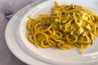 Spaghetti Carbonara is seen on the restaurant table in Milan, Italy on October 7, 2021. (Photo by Jakub Porzycki/NurPhoto via Getty Images)