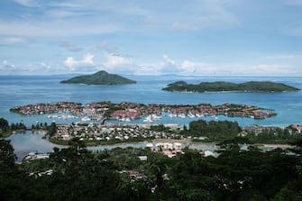 A picture taken on November 18, 2019, shows Eden islands, an artificial island of a luxurious residential marina in Mahe island, the largest island contains the capital city of Victoria, Seychelles. - The Seychelles, a byword for luxury holidays and Instagram-perfect beaches, lives off tourism. But the idyllic honeymoon abode is confronting a tug-of-war over how to keep the economy growing, while protecting its fragile ecosystem.
High-end tourism, mainly from Europe, helped pull the Seychelles from the brink of financial ruin after the 2008 economic crisis. Visitor numbers doubled in the decade that followed to around 360,000 today. (Photo by Yasuyoshi CHIBA / AFP) (Photo by YASUYOSHI CHIBA/AFP via Getty Images)