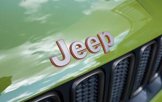 The word "Jeep" on a green Jeep vehicle.