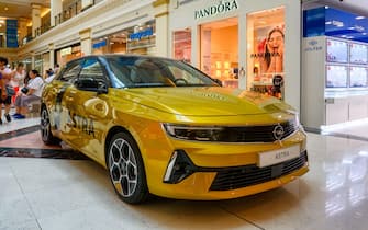 Plaza Mar 2 shopping mall in Alicante, Spain: A new Opel Astra car is being promoted in a corridor of the building interior