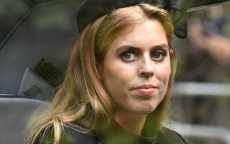 1243361288 LONDON, ENGLAND - SEPTEMBER 19: Princess Beatrice of York follows the coffin of Queen Elizabeth II, draped in the Royal Standard, as it travels on the State Gun Carriage of the Royal Navy, from Westminster Abbey to Wellington Arch September 19, 2022 in London, England. Elizabeth Alexandra Mary Windsor was born in Bruton Street, Mayfair, London on 21 April 1926. She married Prince Philip in 1947 and ascended the throne of the United Kingdom and Commonwealth on 6 February 1952 after the death of her Father, King George VI. Queen Elizabeth II died at Balmoral Castle in Scotland on September 8, 2022, and is succeeded by her eldest son, King Charles III. (Photo by Paul Ellis - WPA Pool/Getty Images)