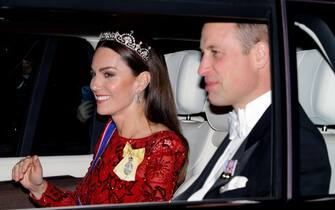 LONDON, UNITED KINGDOM - DECEMBER 06: (EMBARGOED FOR PUBLICATION IN UK NEWSPAPERS UNTIL 24 HOURS AFTER CREATE DATE AND TIME) Catherine, Princess of Wales (wearing the Lotus Flower Tiara) and Prince William, Prince of Wales depart after attending the annual Reception for Members of the Diplomatic Corps at Buckingham Palace on December 6, 2022 in London, England. This year's Reception for the Diplomatic Corp is the first hosted by King Charles III and the first since 2019 following a two year hiatus due to the COIVD-19 pandemic. (Photo by Max Mumby/Indigo/Getty Images)