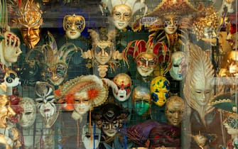 Decorative masks hanging in store window