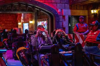 Guests remove their visors after riding Mario Kart: Bowser's Challenge during a media preview of Super Nintendo World theme park at Universal Studios Hollywood in Universal City, California, US, on Thursday, Feb. 16, 2023. The interactive replica of Nintendo Co.'s lands and characters will open to the public on February 17. Photographer: Kyle Grillot/Bloomberg via Getty Images