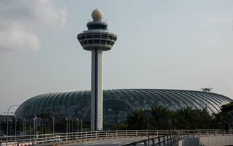 1038459596 The photo was taken from right window of commercial airplane, Singapore (SIN) to Tokyo Haneda (HND) in the daytime. The terminal in the photo is Terminal 1.