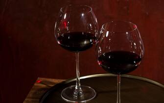 Brunello di Montalcino wine glasses, red italian wine, dark background