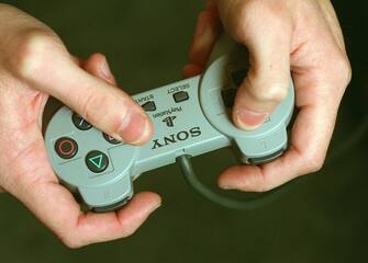 FI.Tester/Hands.RDL (kodak) A closeÂ up of the hands of Aaron Lenz, lead product analyst for Virgin Interactive Entertainment with a Sony PlayStation control used to test the game Grandslam 97 at the Irvine facility. TIMES  (Photo by Robert Lachman/Los Angeles Times via Getty Images)