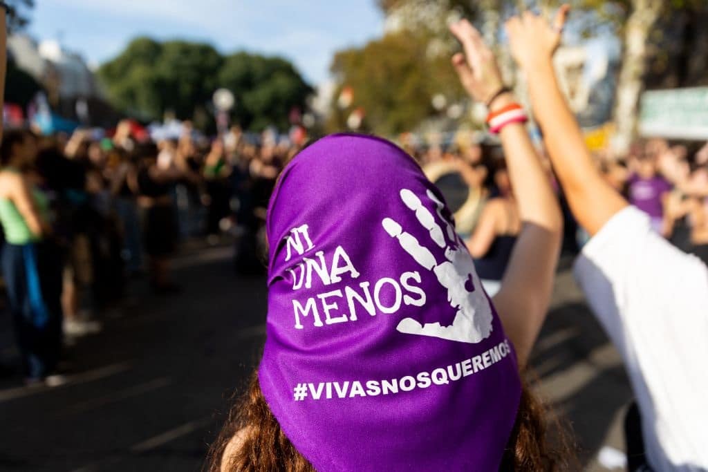 An activist wearing a headscarf takes part in the 8th annual "Ni una menos" (Not One Less) demonstration against gender violence in front of the Argentine National Congress in Buenos Aires, on June 3, 2023. Argentines turned out for the annual march against persistent gender-based violence Saturday, only days after a young woman was killed by a coworker who had harassed her. The now-iconic "Ni una menos," or "Not one less," chant is also meant to call attention to economic inequalities suffered by women, which many consider a form of violence in itself for limiting women's ability to extract themselves from dangerous situations. (Photo by Tomas CUESTA / AFP) (Photo by TOMAS CUESTA/AFP via Getty Images)