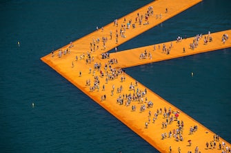 SULZANO, ITALY - JUNE 28: Aerial view of the installation "The Floating Piers" by artist Christo Vladimirov Yavachev. The work connects the village of Sulzano to the small island of Monte Isola and another very small island (SÃ£o Paulo Island) on June 28, 2016 in Sulzano, Italy. Christo died on Sunday, May 31, 2020, of natural causes in his home in New York City in the United States at the age of 84. (Photo by Fabrizio Villa/Getty Images)