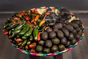 A tray with avocados and Jalapeno chili peppers is on display at the 20 de Noviembre market on February 27, 2017 in Oaxaca, Mexico. / AFP PHOTO / Omar TORRES        (Photo credit should read OMAR TORRES/AFP via Getty Images)