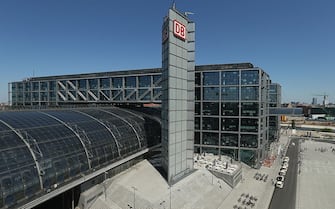 BERLIN, GERMANY - MAY 15:  Hauptbahnhof train station stands under spring weather on May 15, 2013 in Berlin, Germany. Meinhard von Gerkan, the architect who designed the station, is demanding that the roof be extended according to the original design, and claims that because the pieces already exist and are currently in storage, that the entire procedure would only take four weeks. Deutsche Bahn, Germany's state railway carrier that owns Hauptbahnhof station, cut short construction of the roof from 420 meters to 350 meters in order to complete the station in time for 2006 World Cup.  (Photo by Sean Gallup/Getty Images)