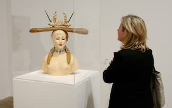 London, UNITED KINGDOM: A woman looks at a Salvador Dali sculpture entitled Retrospective Bust of a Woman created in 1933, at the Tate Modern art gallery, London, 30 May 2007. Tate Modern are displaying a range of works of art by Salvador Dali including films sculptures and paintings. AFP PHOTO/CARL DE SOUZA. (Photo credit should read CARL DE SOUZA/AFP via Getty Images)