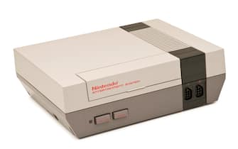 "Medina, Ohio, USA - February 7, 2011: An original vintage Nintendo Entertainment System, released in 1984. The 8-bit NES was Nintendo\'s first cartridge-based console home system."