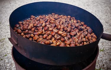 Roasted chestnuts. Cooking chestnuts. Italy. Europe.