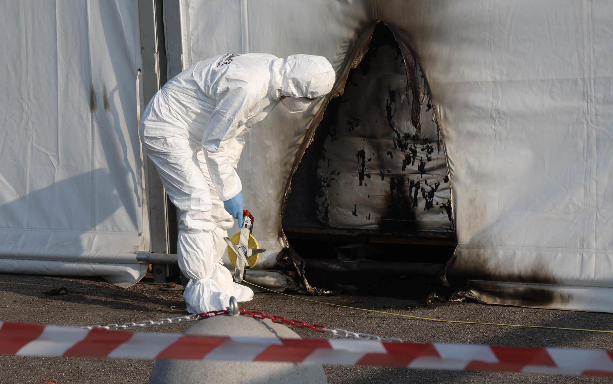 The scientific police and firefighters on the spot where two incendiary bottles were thrown at the structure that houses the tampon center and anti-Covid vaccination center in Brescia, Italy, 03 April 2021. The investigations are entrusted to the police who are trying to reconstruct what happened also through the security cameras installed on the street.
ANSA/FILIPPO VENEZIA